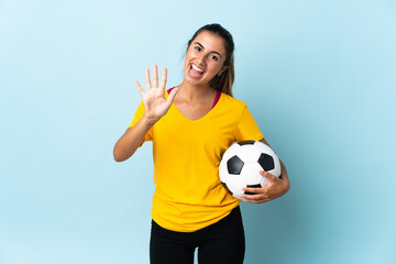 Young hispanic football player woman over isolated on blue background counting five with fingers