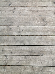 texture of old gray-brown wooden boards with cracks and rusty nails