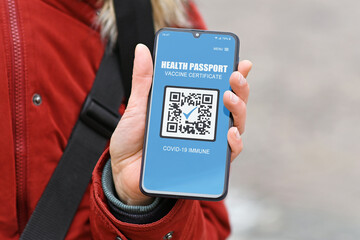 Concept for Corona virus vaccination passport on mobile phone device to allow vaccinated people...