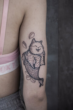 Tattoo on the arm. Tattoo on the girl. Japanese tattoo style