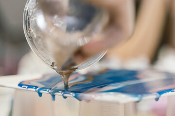 flowing blue gold epoxy resin drips down