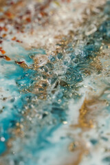 vertical background modern abstract design made with epoxy resin. blotches of amber, gold, transparent and turquoise stones