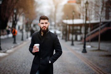 bearded; bearded man; man; drinking coffee; coffee shop; coffee cup; coffee; portrait; beard; young man; beard man; haircut; autumn; brutal; mustache; masculine; hairstyle; outdoors; sexy; looking; ja