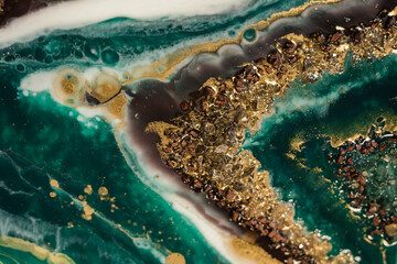 beautiful contemporary art in resin art technique. rich green and turquoise lines merge and turn...