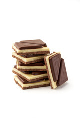 Stack of pieces of milk chocolate isolated on white background