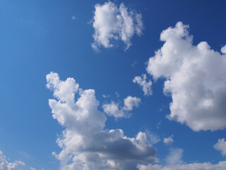 Bright blue sky with white clouds