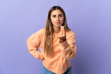 Young hispanic woman over isolated purple background making Italian gesture