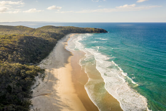 Aerial view of Alexandra Bay paradise beach near Hell's Gate promontory facing the blue Pacific Ocean, Queensland, Australia.