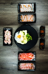 fresh raw pork, meat ,beef, belly, sliced on square plate  on wood, wooden background,set shabu, hot pot ingredients.