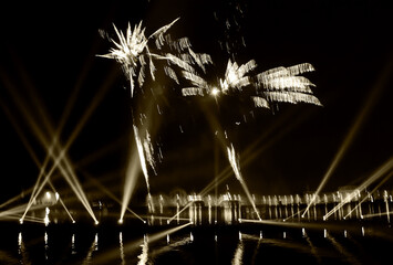 Fireworks over on the Arsenal lagoon during the Carnival celebration in Venice, Italy. Reflection...