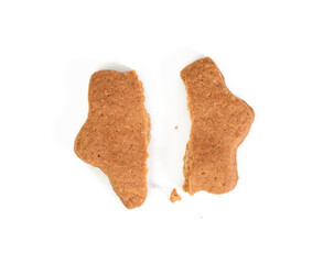 Star shaped baked chocolate gingerbread cookie cut in half