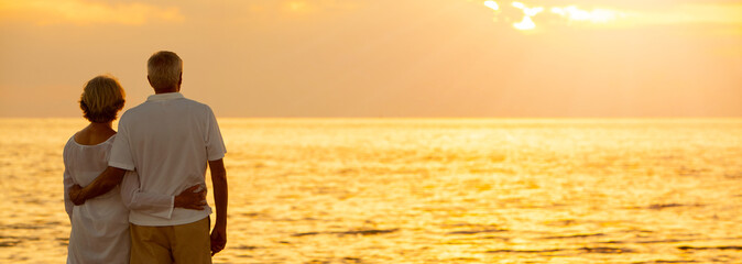 Senior Couple Sunset Tropical Beach Panorama Web Banner - obrazy, fototapety, plakaty