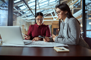 Busy brunette woman working at project in team