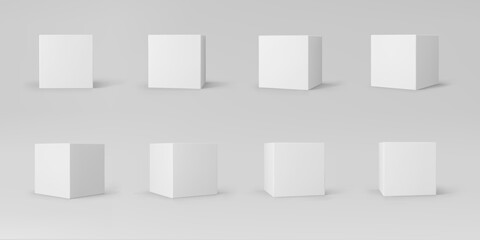 Fototapeta na wymiar White 3d cubes set with perspective isolated on grey background. 3d modeling box with lighting and shadow. Realistic vector icon