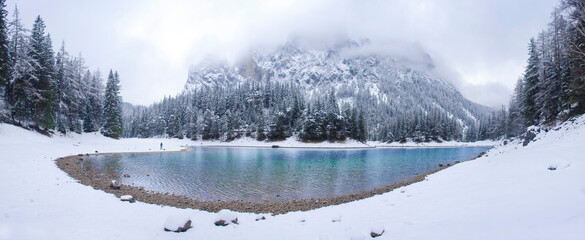 Amazing winter landscape with snowy mountains and clear waters of Green lake (Gruner see), famous tourist destination in Styria region, Austria