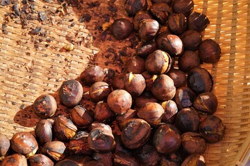 Roasted chestnuts in a basket, Japan - 焼き栗