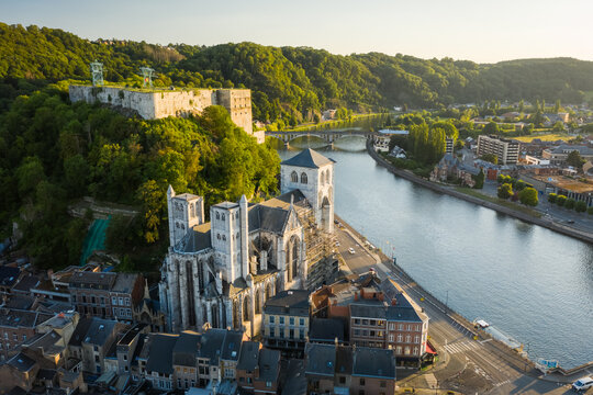 Aerial view of Notre Dame et Saint Domitien church along Meuse river in Huy, Li&egrave;ge, Belgium.