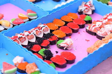 Plenty of sushi in a container