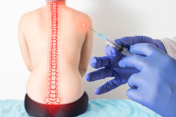 The doctor holds a syringe with medical medicine against the background of a patient with back...