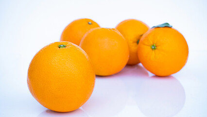 Ripe Orange, Golden Yellow Peel Lots on white background with shadows and reflections