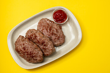 fried ground meat with tomato sauce on dish