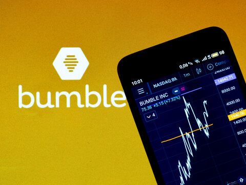 In this photo illustration the stock market information of Bumble Inc. displays on a smartphone while the logo of Bumble Inc. displays as the background