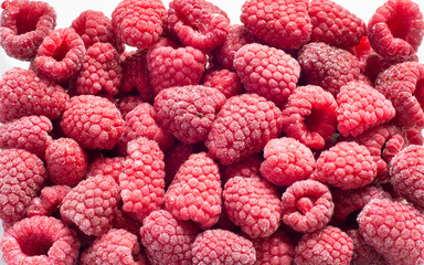 Fresh frozen raspberry top view. background