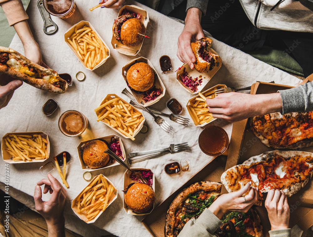 Wall mural lockdown family fast food dinner from delivery service. flat-lay of friends group eating burgers, fr