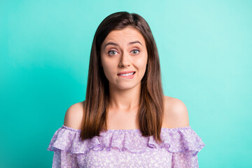 Portrait of stressed girl bite lips wear purple shirt open mouth isolated on blue color background