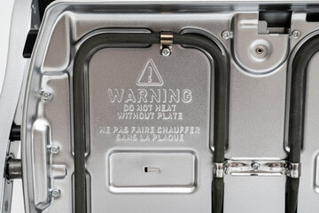electric grill with open lid. the panels were removed. Made of stainless steel, special non-stick...
