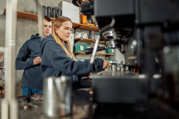 Happy smiling professional barista in cafe