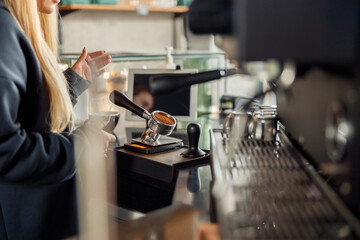 Happy smiling professional barista in cafe