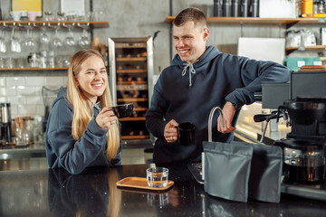 Happy smiling professional barista in cafe