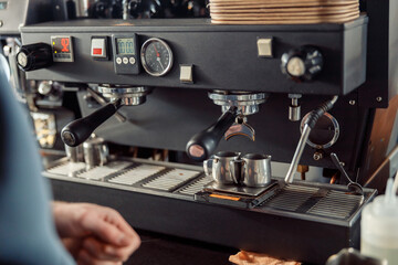 Happy smiling professional barista in cafe