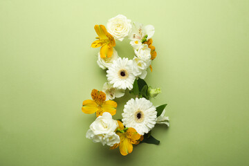 Number 8 made of beautiful flowers on green background, flat lay. International Women's day