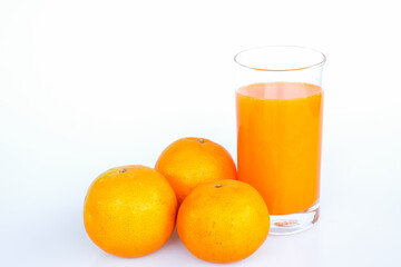Oranges and Fresh Orange juice ready to drink. Isolated on white background.