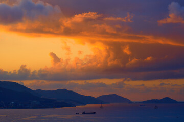 Spectacular tropical clouds over the islands. Nature background. Blue yellow colors.