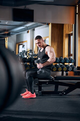 Young strong man working out upper body