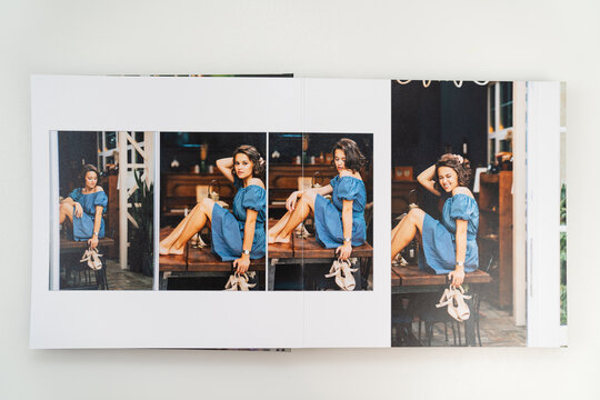 pages of photobook from photo shoots of beautiful brunette woman in retro house.