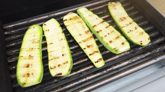Zucchini on grill.  Chef prepares grilled  zucchini
