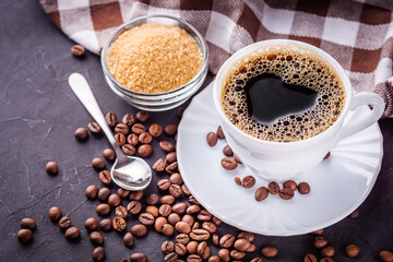 cup of fragrant fresh coffee on a dark stone background