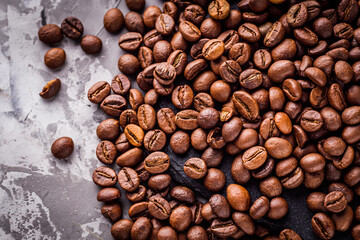 aromatic fresh coffee beans on a dark stone background