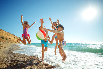Cute kids having fun on the sandy beach in summer. High quality photo. - 414083036
