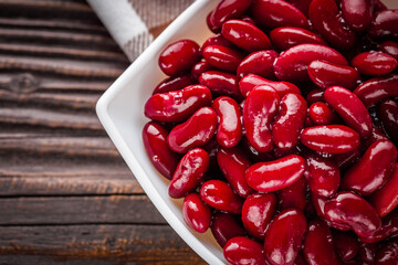 canned red kidney beans on a dark wooden rustic background