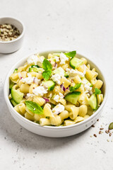 Spring fresh light vegan cucumber pasta salad. Space for text.