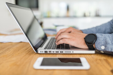 Man using his laptop at home