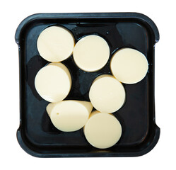 fresh raw tofu sliced on square plate isolated on white background, shabu, hot pot ingredients