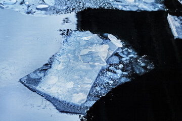 Luxurious blue ice floes in winter water