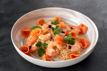 Funchose salad with prawns, papaya, herbs and soy sauce.