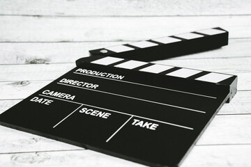 Clapper board on white wood